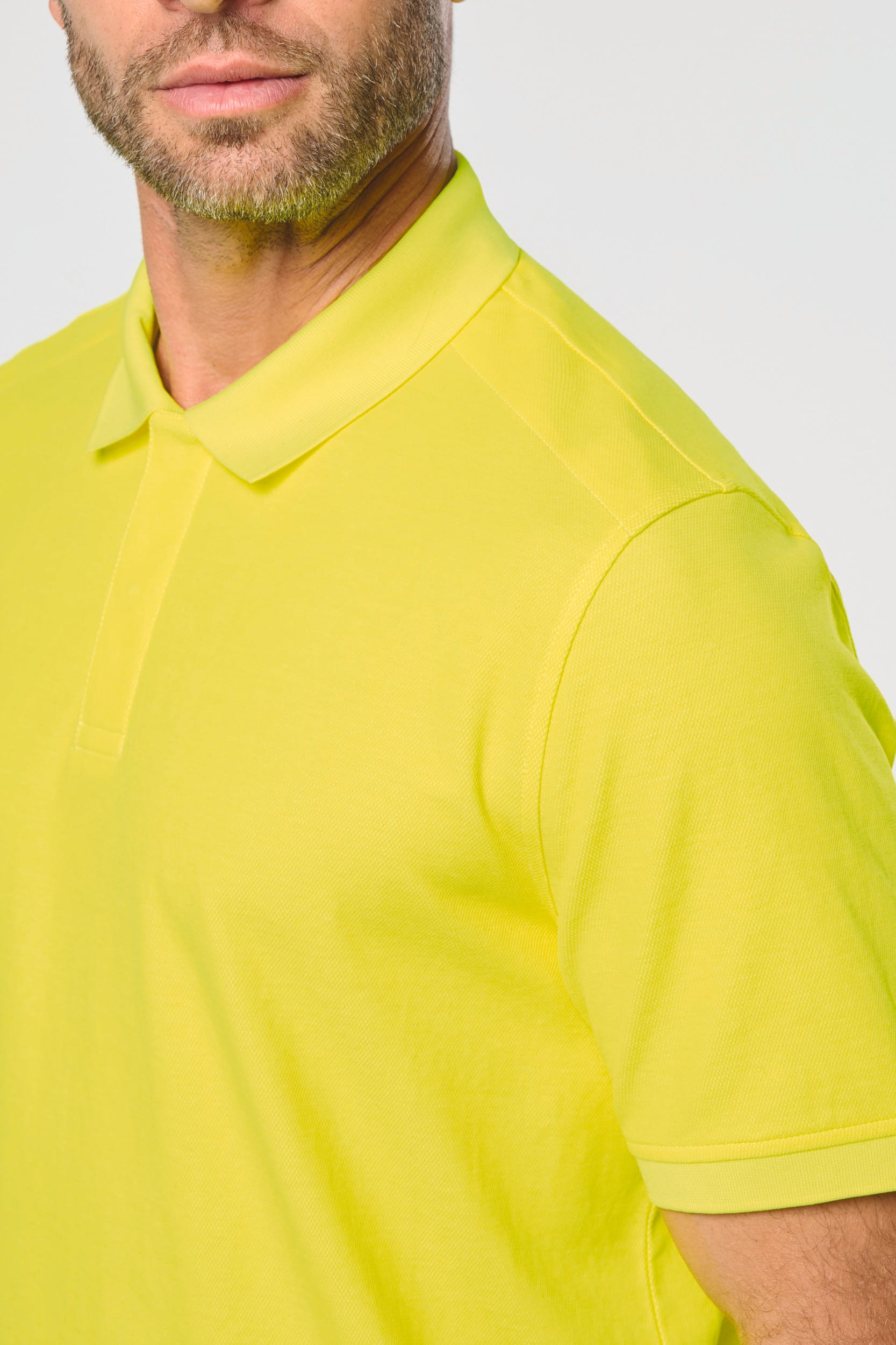 Polo fluorescent unisexe en coton et polyester recyclé | WK208